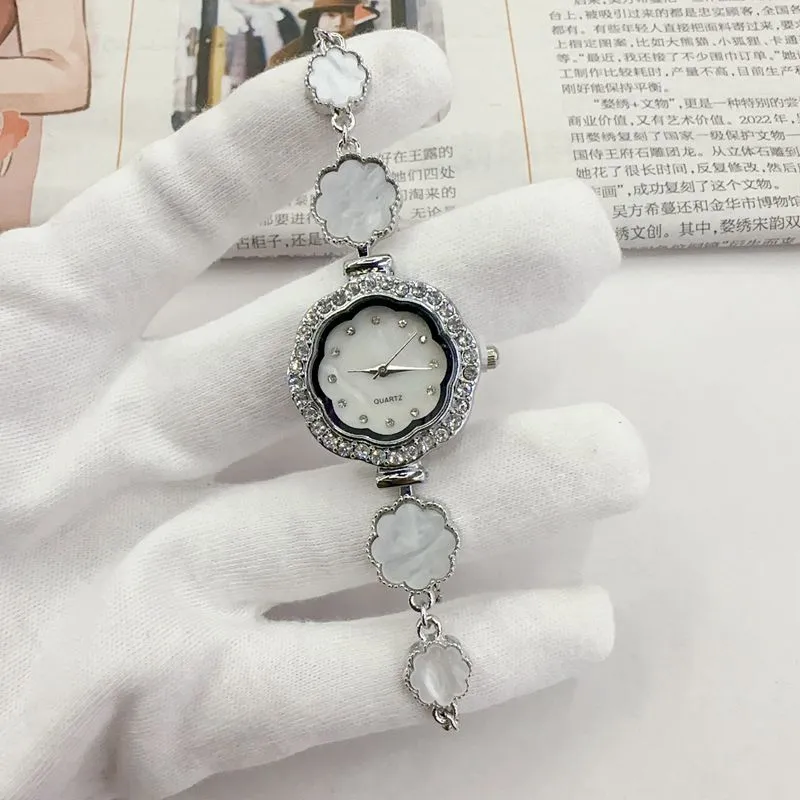 Light luxury, niche temperament, diamond-encrusted flower-shaped drawstring bracelet watch